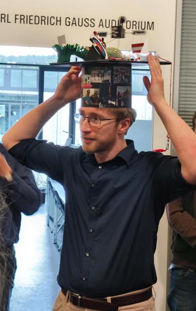 Philipp putting on his doctoral hat